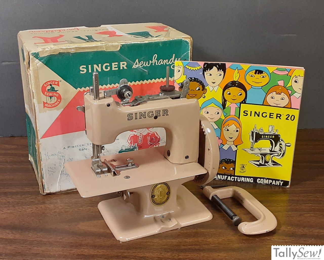 full post-war packaging spread - box, clamp, and manual alongside the Tan 20-10
