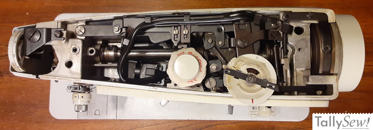 Flexi stitch cam with the holder retainer screw