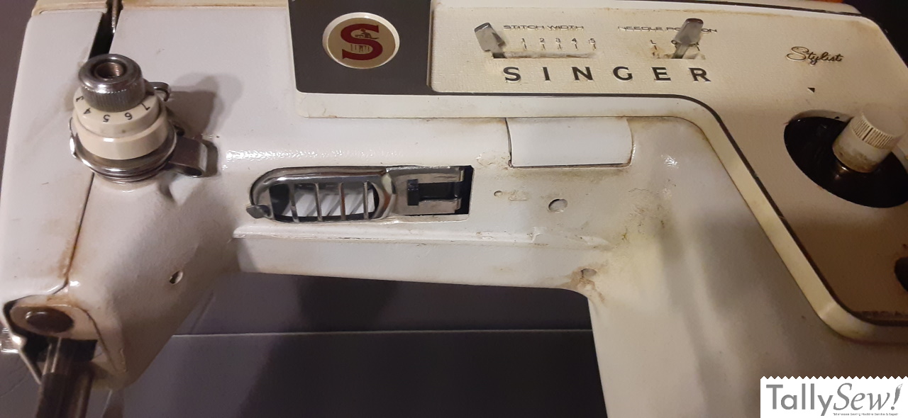 Under the arm of the machine showing the light fixture