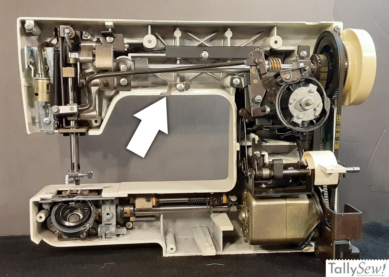 Machine frame, and takedown lever (arrow)