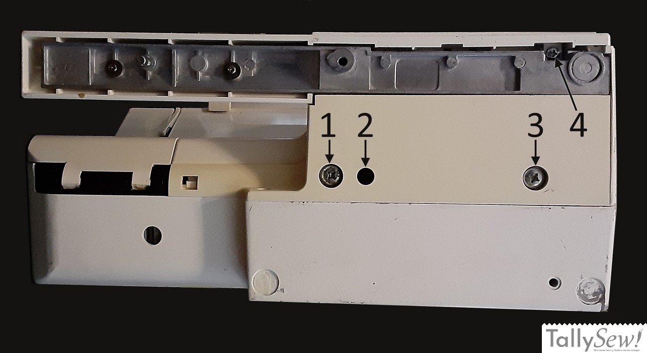 Underside of the machine with screws indicated