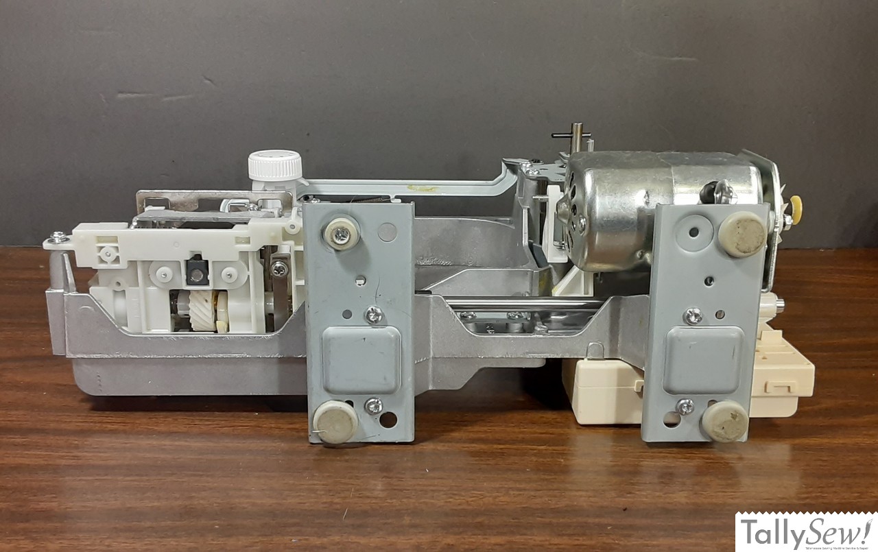 Brother JX2517 sewing machine with its outer plastic shell removed, Photo taken from the underside of the machine