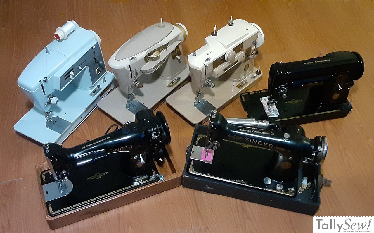A lineup of the six vintage Singer sewing machines known as the 'Big Six.' The image displays the Singer 101-4, 201-2, 301A, 401A Slant-O-Matic, 500A Rocketeer, and the 600 Auto-Reel models.