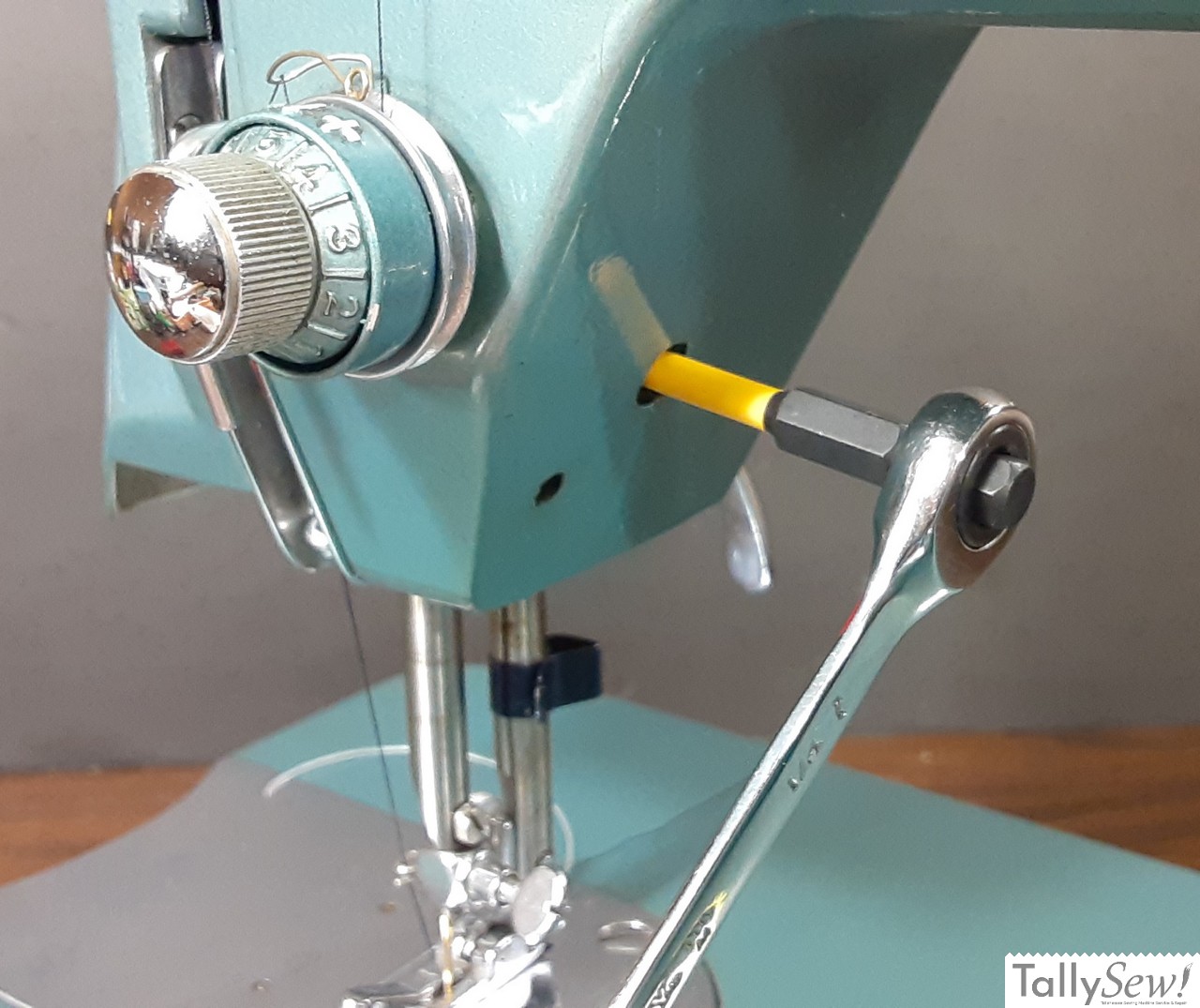 Morse 600. Access the needle bar clamp through the right side of the needle bar box
