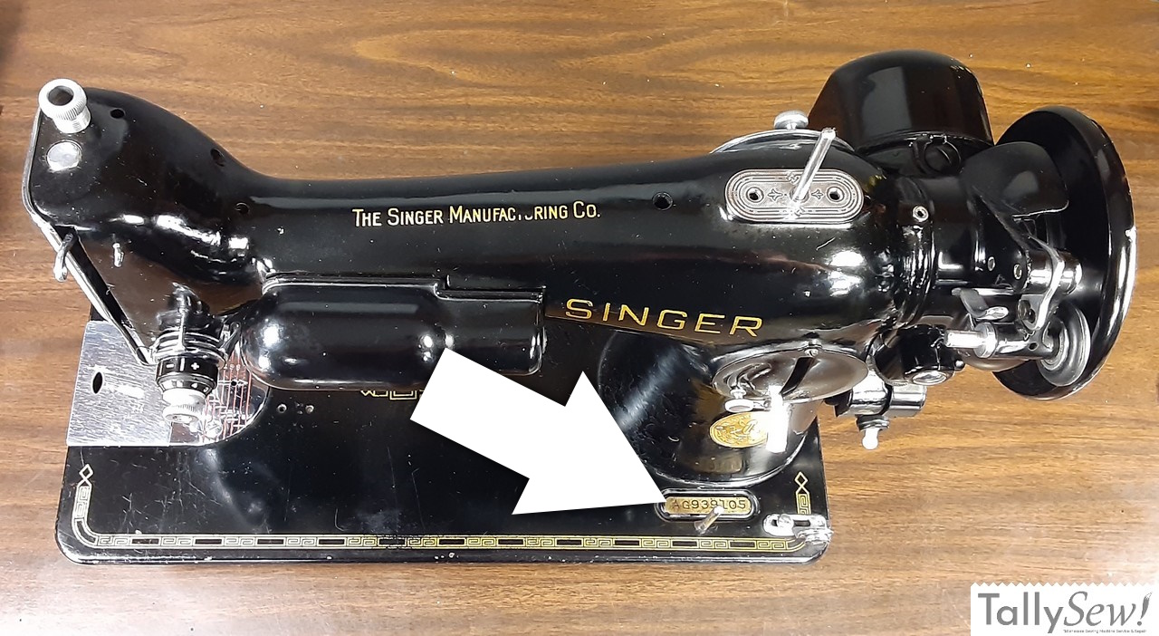 An annotated photo of a Singer 201-2, with an arrow indicating the serial number's location on a small plaque at the front of the machine's base, below the stitch regulator.