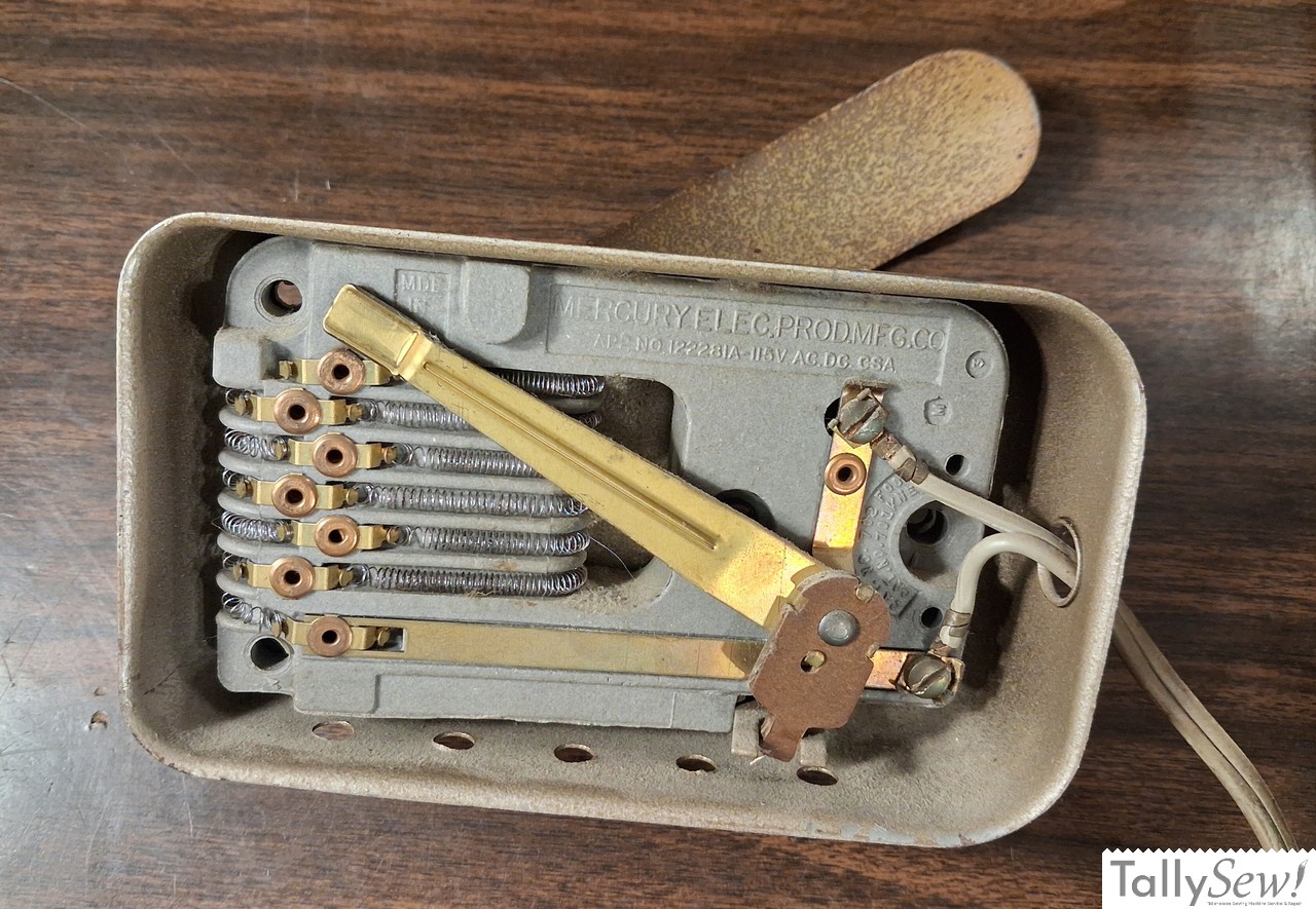 Underside of in cabinet knee bar
