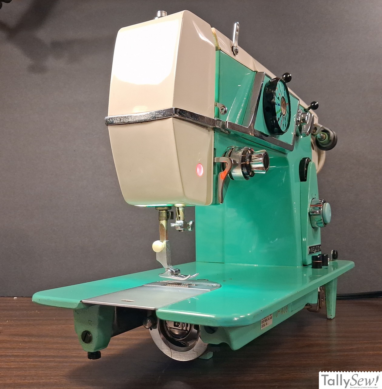 Vintage mint green Nelco R-1000 Class 15 sewing machine from the left end