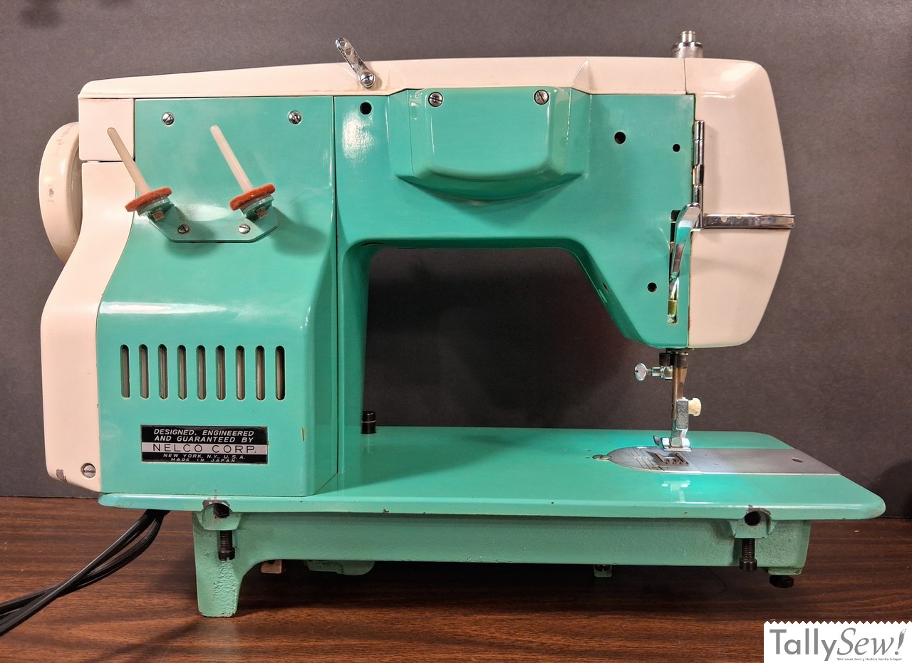 Vintage mint green Nelco R-1000 Class 15 sewing machine from the back