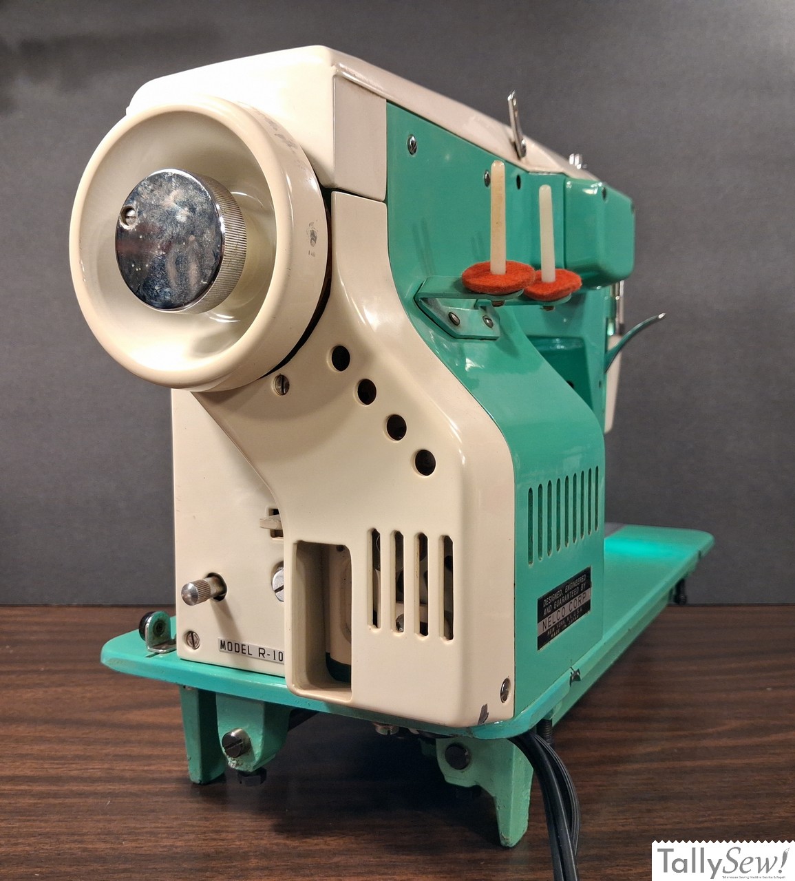 Vintage mint green Nelco R-1000 Class 15 sewing machine from the right end